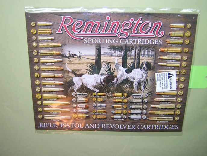.Remington antique style sign with bullets